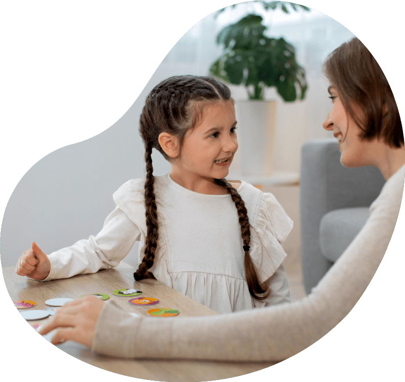 Medium shot mother and girl playing game